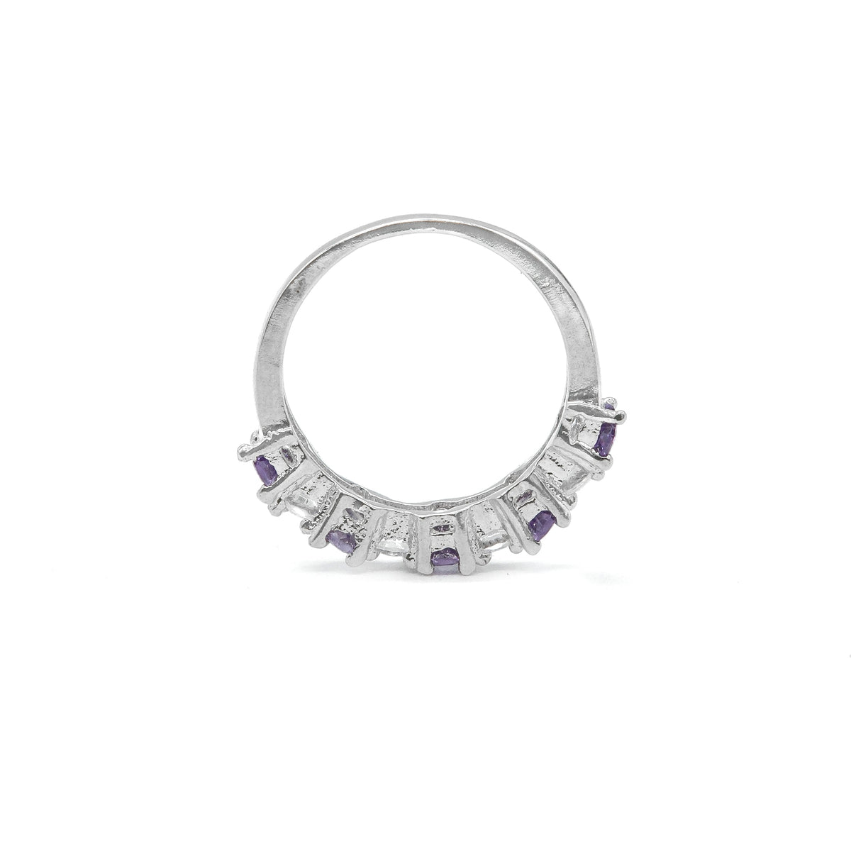A silver ring featuring a semi-circular band adorned with small rectangular purple gemstones and clear stones, shown on a plain white background.