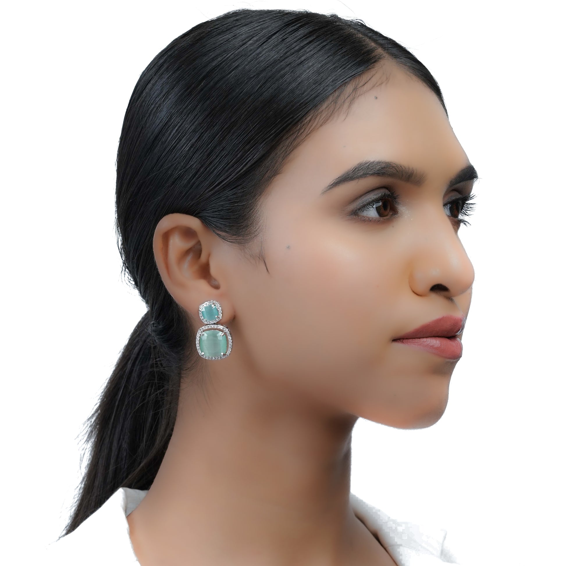 Model in a side profile wearing Teal Green Stone Drop Earrings for Women, showcasing the elegant teal green stones and drop design.