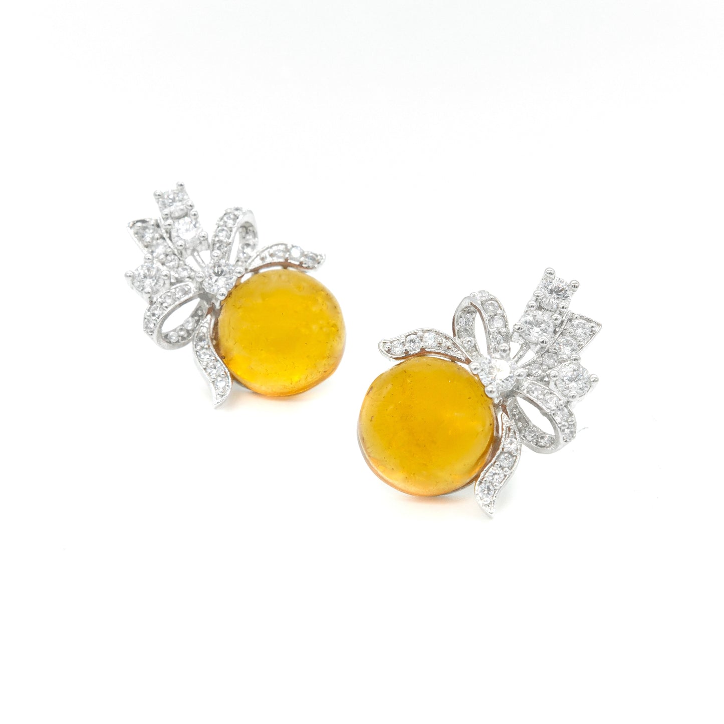 front view of yellow stud earrings showing bow shape and earring 